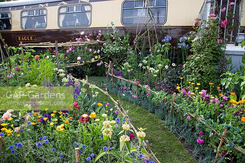 Vintage train and cut flower garden in the 'Made in Birmingham' garden at BBC Gardener's World Live 2018.