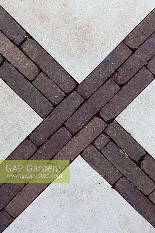 Detail of brick work design through paving stones.
