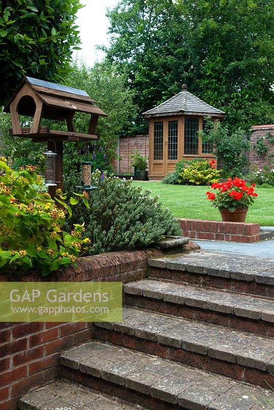 Steps beside bird feeding station, leading to lawn and summerhouse - Open Gardens Day 2014, Laxfield, Suffolk