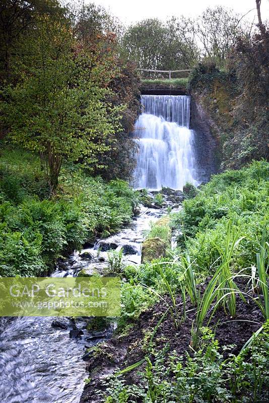 The Edgcumbe Stream tumbles down a waterfall and through the garden to join the River Tamar at Hotel Endsleigh.