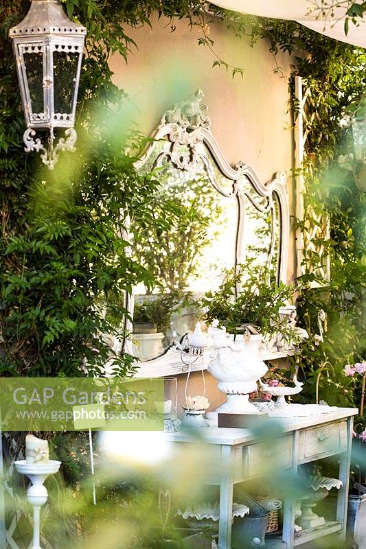 Mirror and sideboard on terrace, Milan.