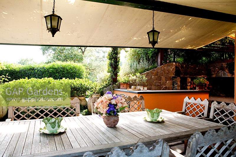 Dining area just outside the house with teak furnishings