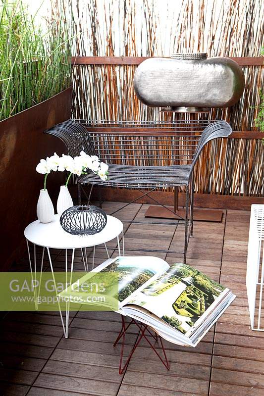 Small terrace garden with modern furniture designed by Antonino Sciortino.