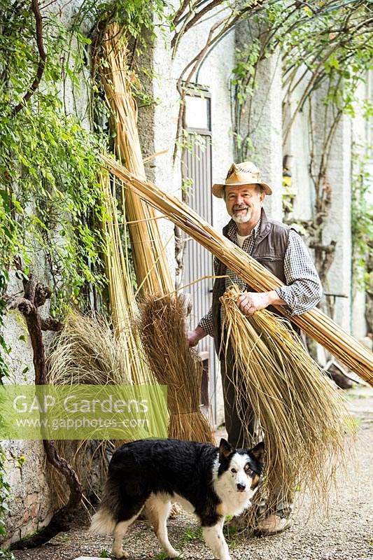 Dino Davanzo with materials for making ornaments, stems of sedge, cattails and swamp rush.