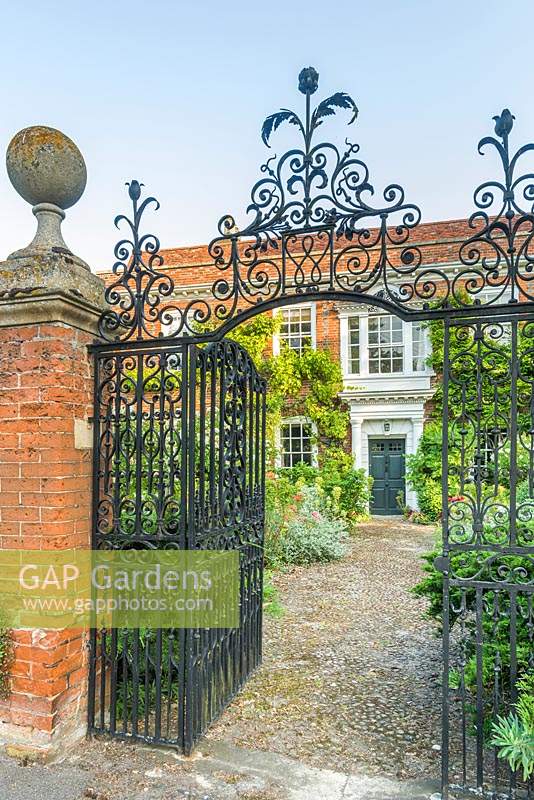 Manor House with wrought iron gateway and cobble front path
