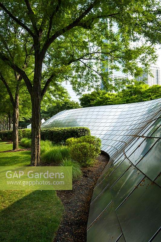 Pedestrian Bridge in public garden in city landscape. 