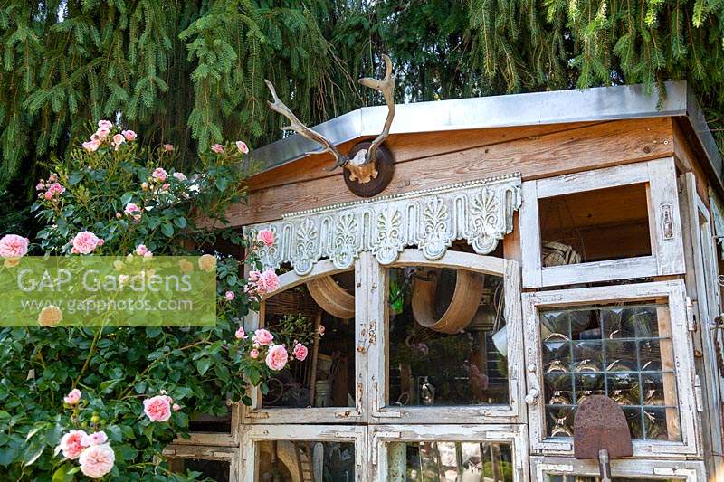 Detail of homemade shed with ornaments and finds