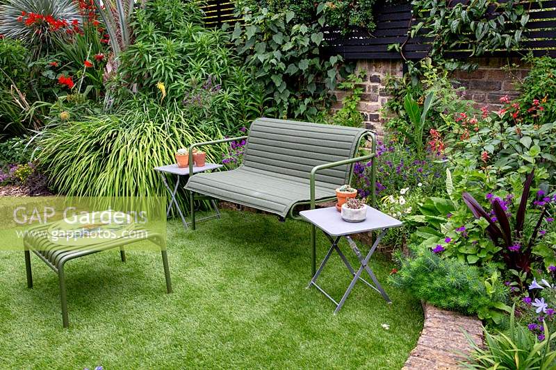 A towards circular artificial lawn with green benches