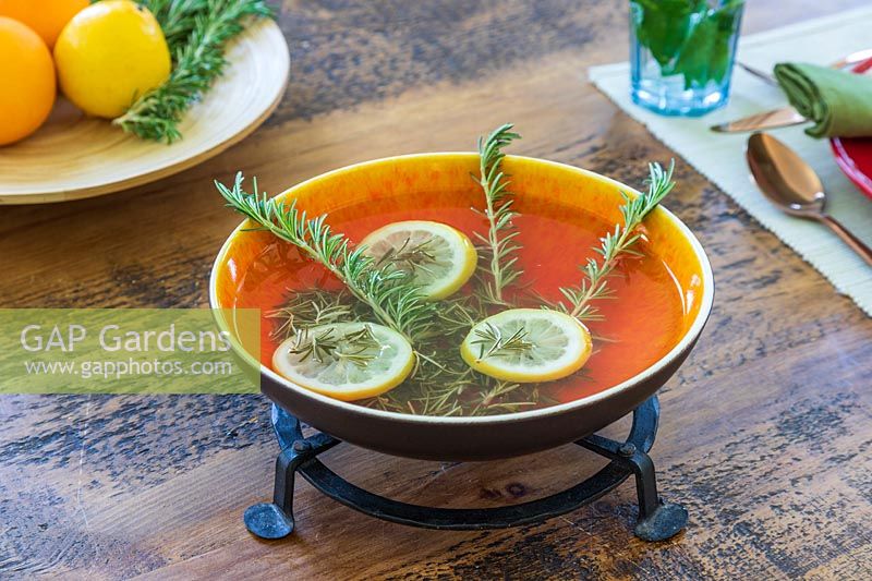Bowl with homemade room scent made with Salvia rosmarinus - Rosemary - and Lemon 