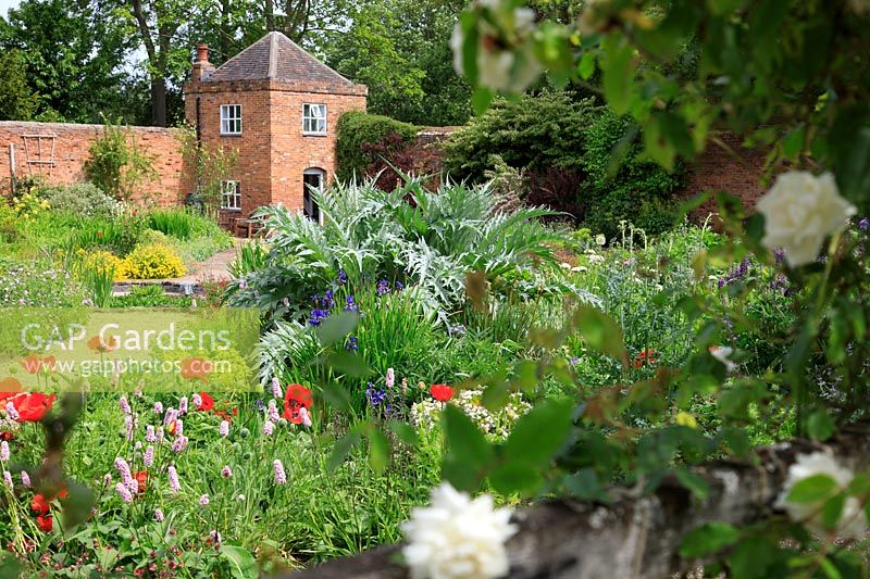 Planting in front of the brick folly built in to the walls of the walled garden.