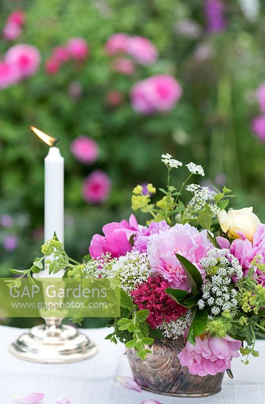 Summer floral arrangement in silverware
