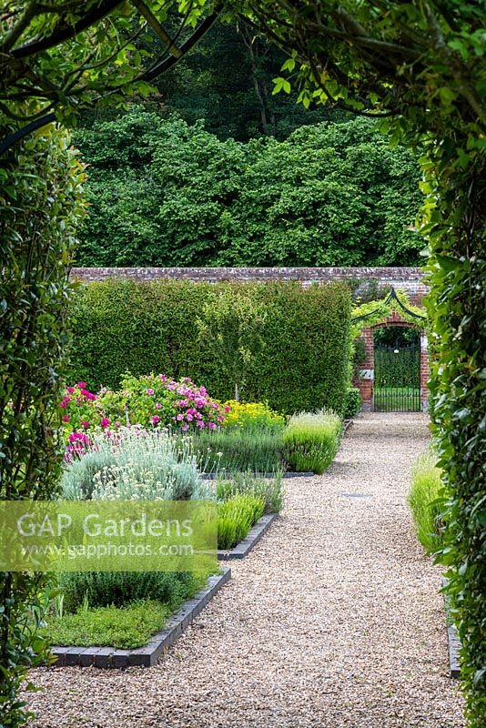 View through hedge to herb garden in the walled garden at Hoveton Hall.