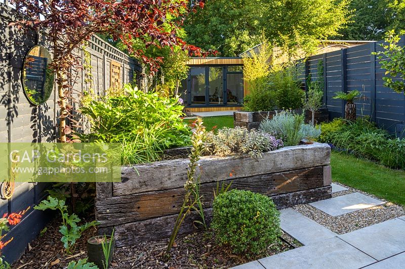 Walthamstow Modern Garden  with Raised Bed and Garden Room by Earth Designs 