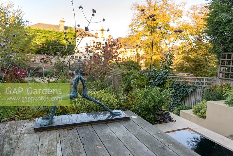 Low maintenance  city garden - view from elevated deck with reflecting pool and Mike Speller's sculpture