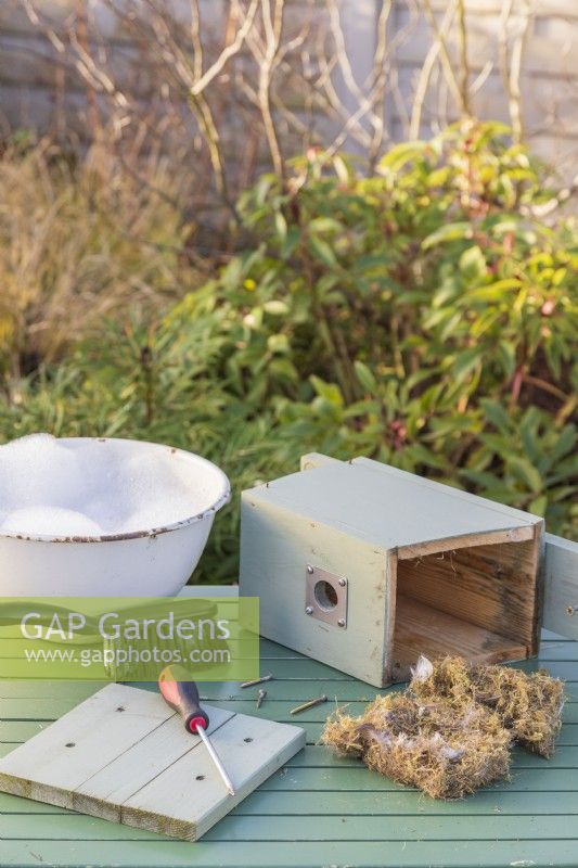 Bird box on table with this years old bedding removed ready for cleaning in Winter to make ready for Spring nesting birds