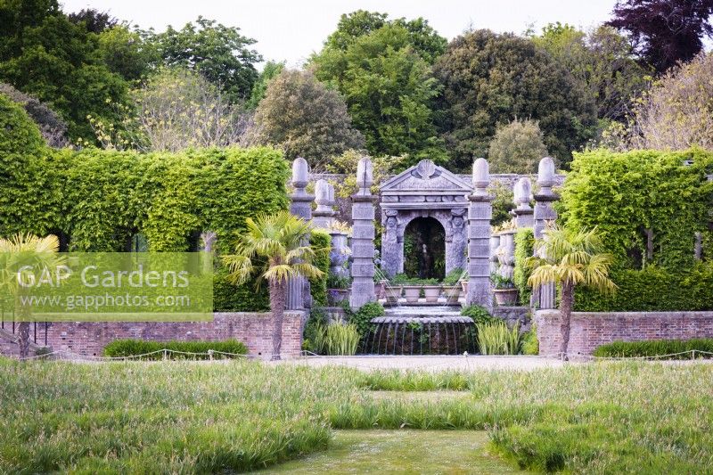 The Collector Earl's Garden at Arundel Castle, West Sussex in May. Designed by Isabel and Julian Bannermann. Hornbeam clad tunnels and pavilions frame green oak pillars and a grotto.