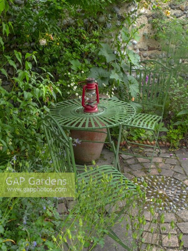 Quiet seating area in secluded garden  June Norfolk