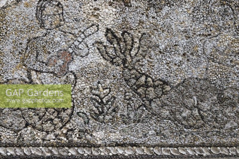 Detail of mosaic of figure and whale on outbuilding of stone, faced with mosaics in black and white. Seixal, near Setubal, Portugal. September