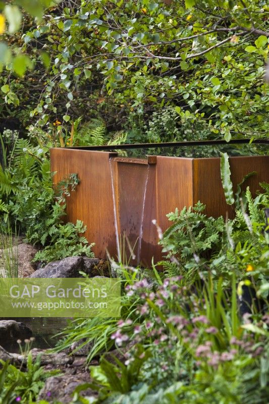 Rusty waterfall feature. The Yeo Valley Organic Garden, RHS Chelsea Flower Show 2021 