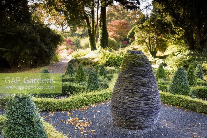 The Slate Garden, a knot garden in box and Lonicera nitida with a central slate sculpture, at Hergest Croft Gardens, Herefordshire in October