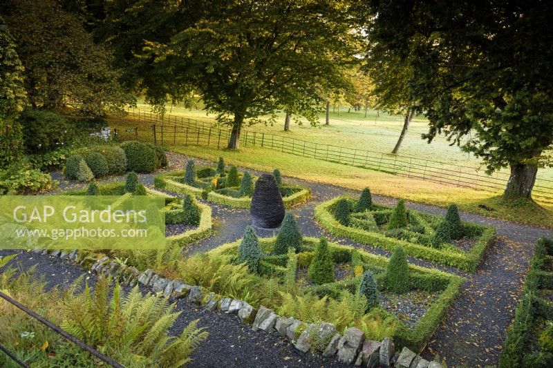 The Slate Garden, designed by Elizabeth Banks, using a number of different varieties of box and Lonicera nitida at Hergest Croft, Herefordshire in October