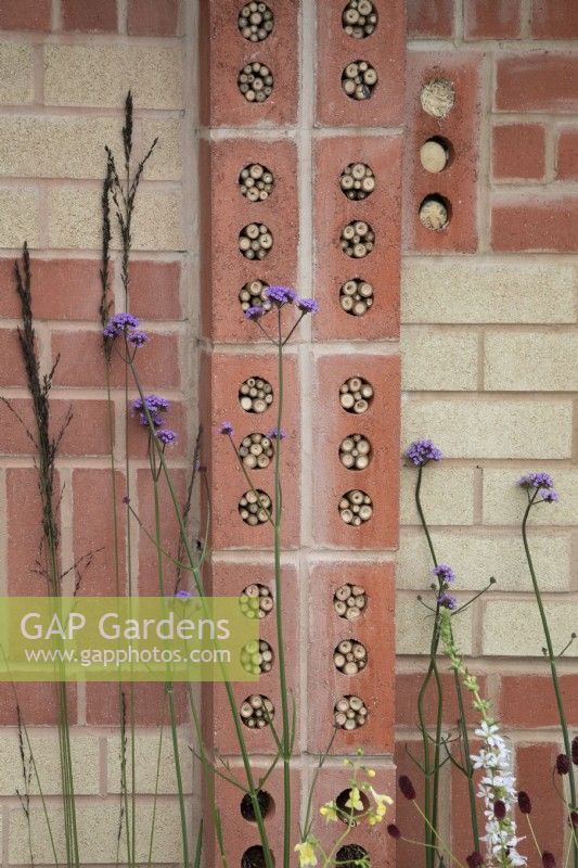 'The Marshalls Garden' at BBC Gardener's World Live 2021 - insect hotels built into decorative brick wall 