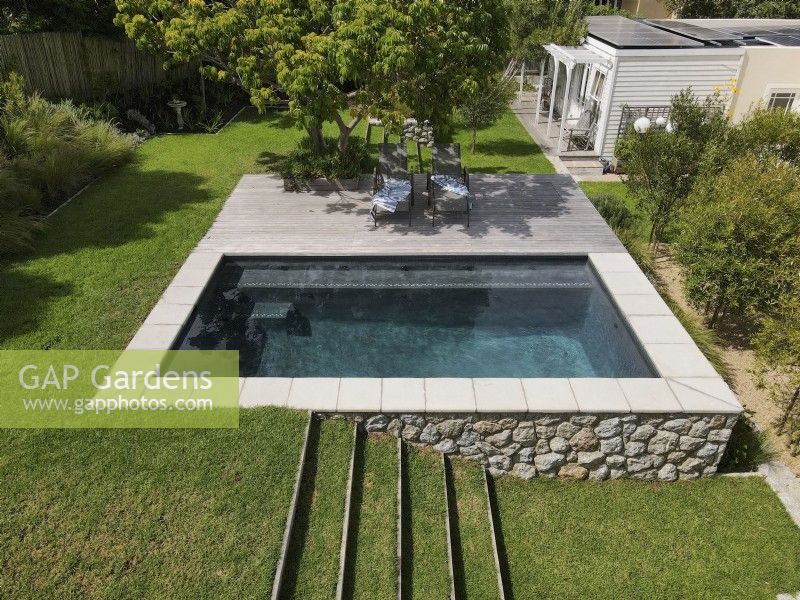 Aerial view of elevated swimming pool in back garden