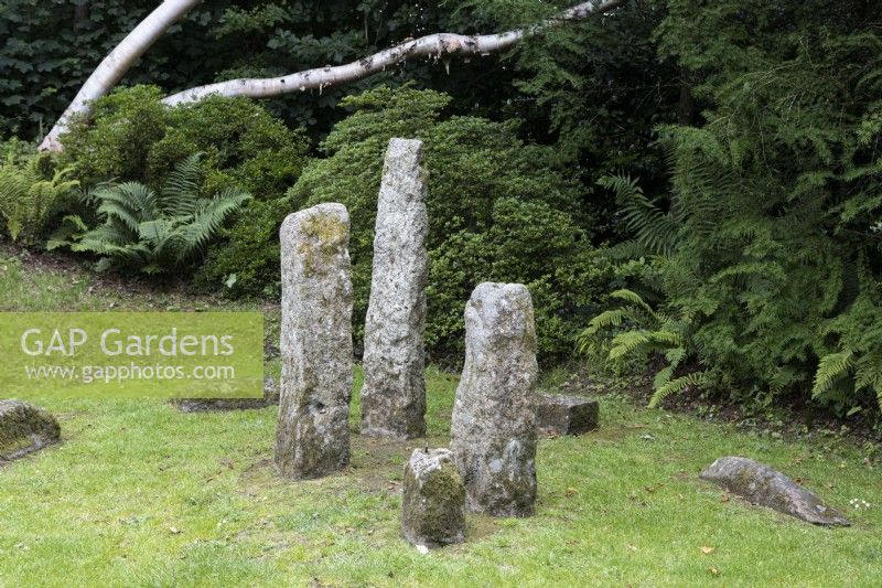 The 'Magic Circle' a stone circle replicating the hut circles on nearby Dartmoor. The Garden House, Yelverton, Devon. Summer. 