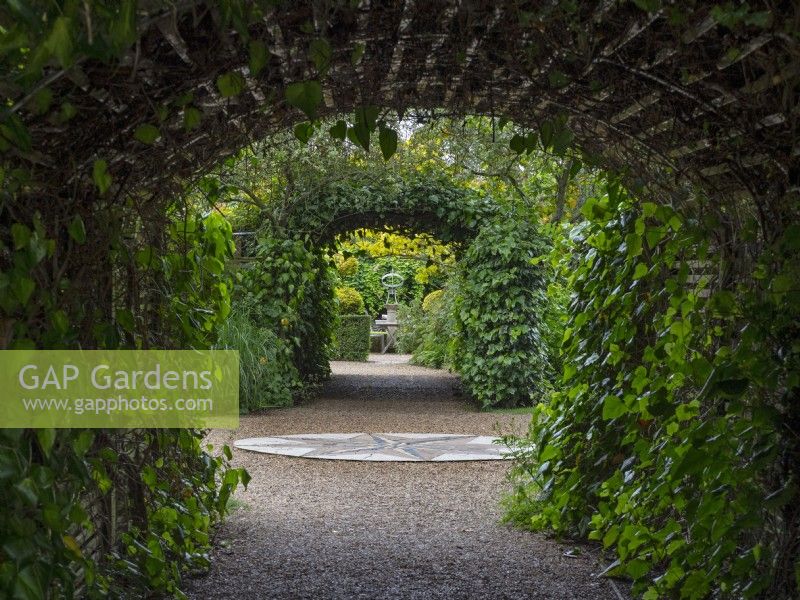 Ivy tunnel and compass East Ruston Old Vicarage Gardens Norfolk
