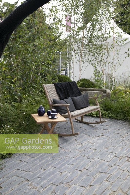 Seating area in the Connections garden at RHS Hampton Court Palace Garden Festival 2022