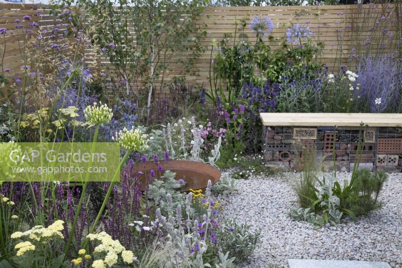 Pink and purple themed perennial planting in Turfed Out at RHS Hampton Court Palace Garden Festival 2022