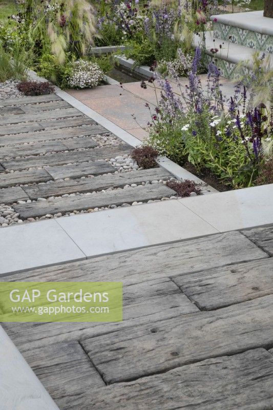 Paving made from old railway sleepers in the Marshalls Landscaping Garden at BBC Gardeners World Live 2022