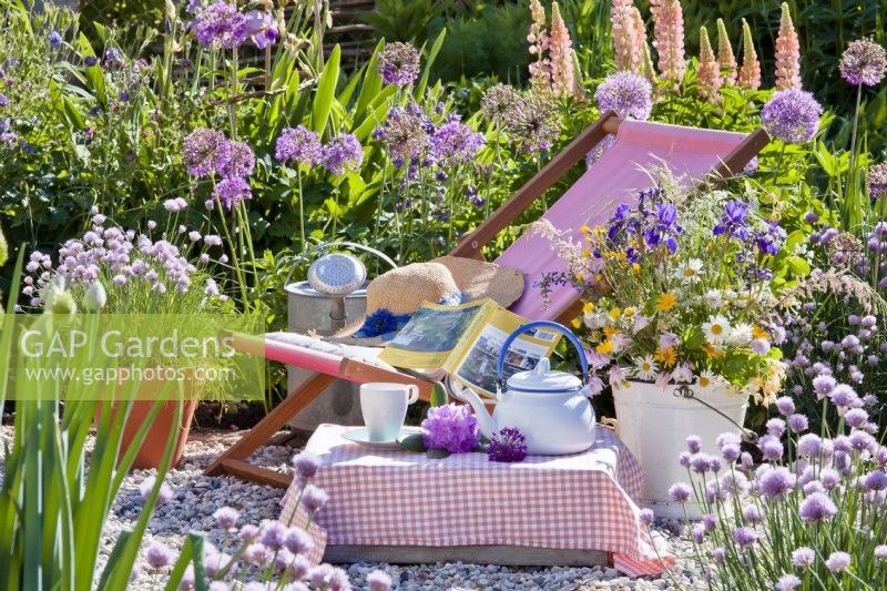 Tea time picnic on gravel patio.