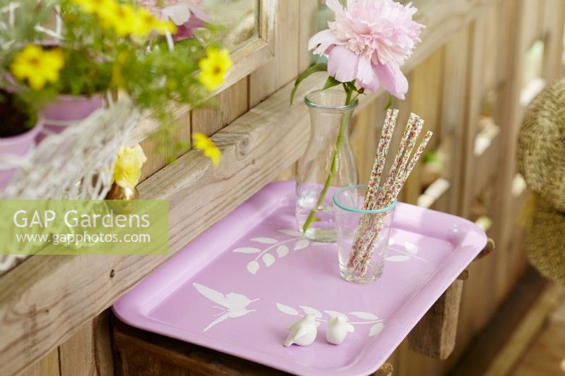 Vintage painted tray on trellis with foliage and butterfly stencils