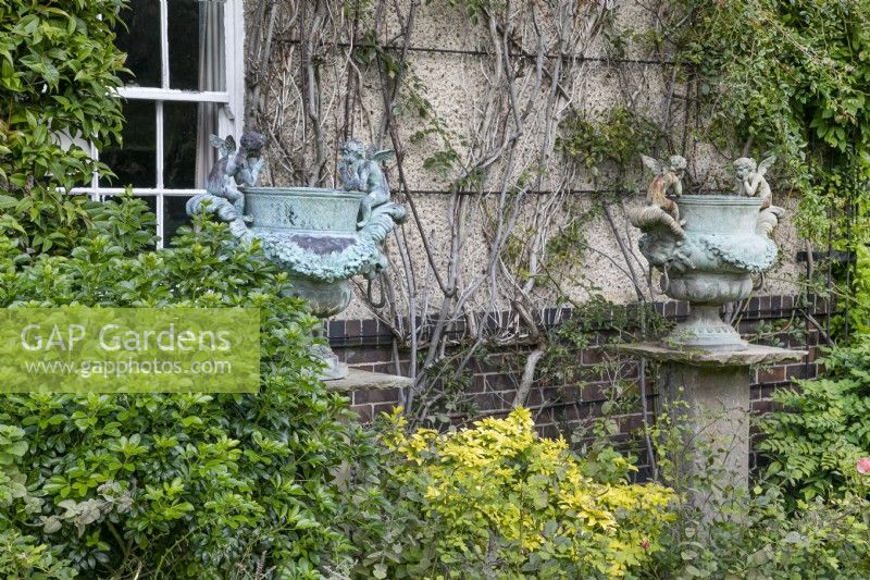 Ornate metal urns at The Burrows Gardens, Derbyshire, in August