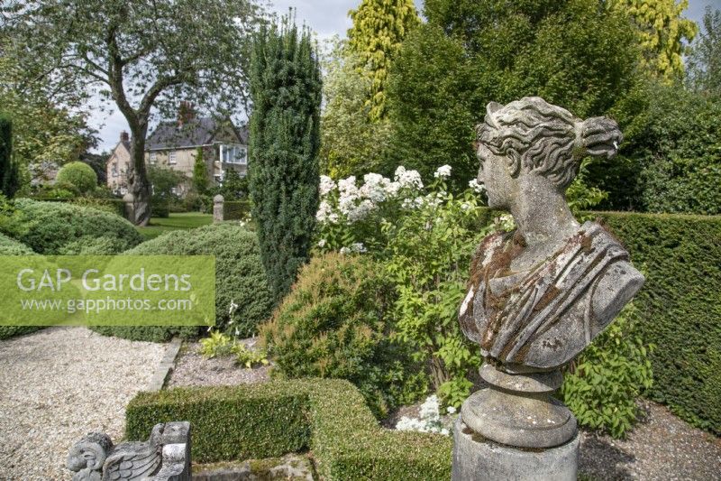 Statuary in The Italian Garden at The Burrows Gardens, Derbyshire, in August