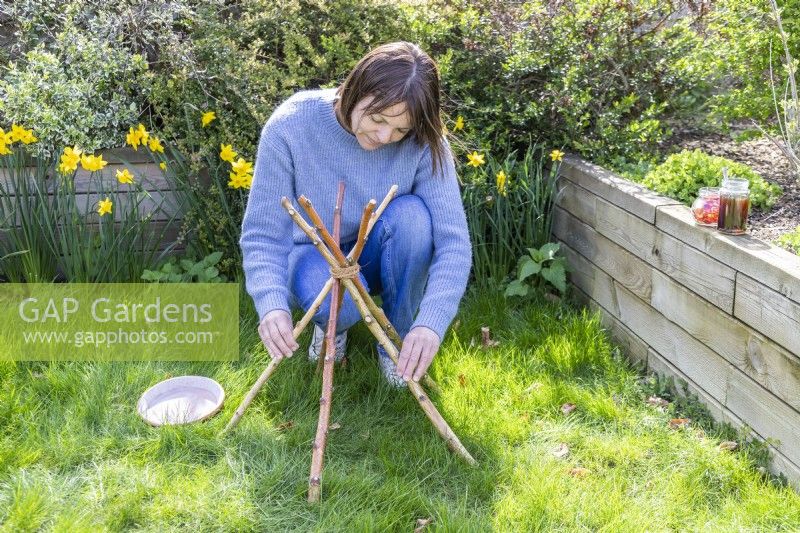 Woman positioning the stand on the ground