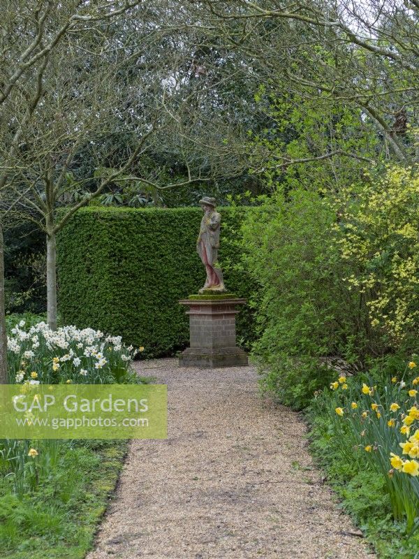 East Ruston Old Vicarage Gardens, Norfolk,  Spring. Statue in woodland area