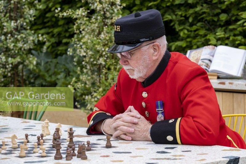 Chelsea pensioner playing chess on the London Square Community Garden,Gold winner, Designer: James Smith