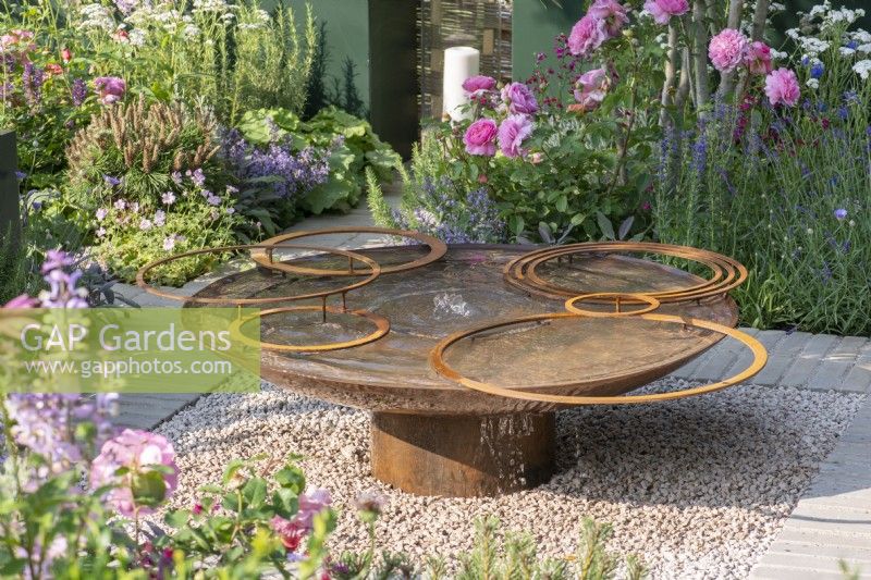 A contemporary water feature crafted from glass and reclaimed aluminium.