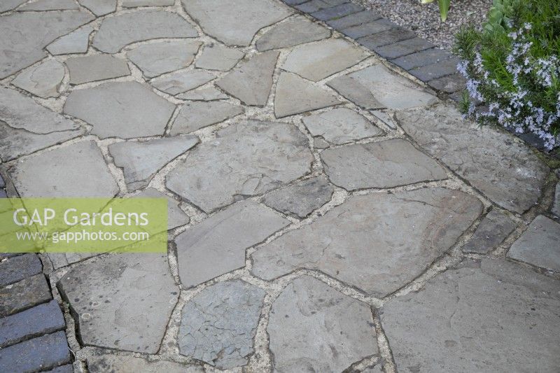 Crazy paving with brick edging
