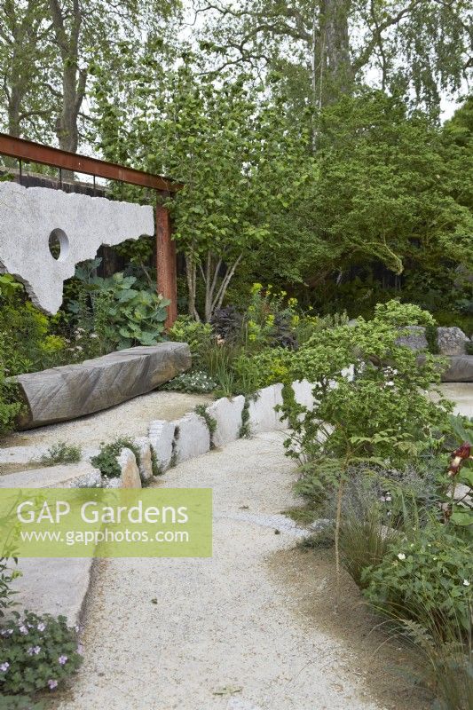 The Samaritans Listening Garden. Designer: Darren Hawkes. Chelsea Flower Show 2023. A garden of salvaged materials and suspended concrete panels. Summer. May.