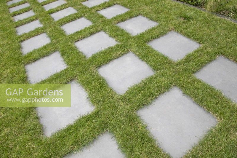 Paving slabs set in grass in private garden open for Charity in Lichfield, June