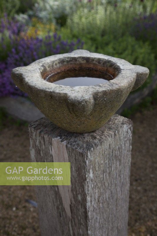  Antique Marble Mortar bowls set on oak post re-purposed as  bird baths.

