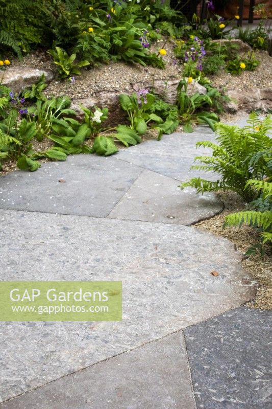 Fossilised Chatsworth stone path on The Boodles British Craft Garden designed by Thomas Hoblyn, Sanctuary Gardens - RHS Chelsea Flower Show 2023