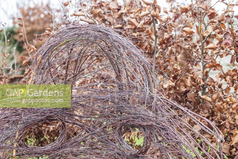 Woven birch protective fence for bird bath