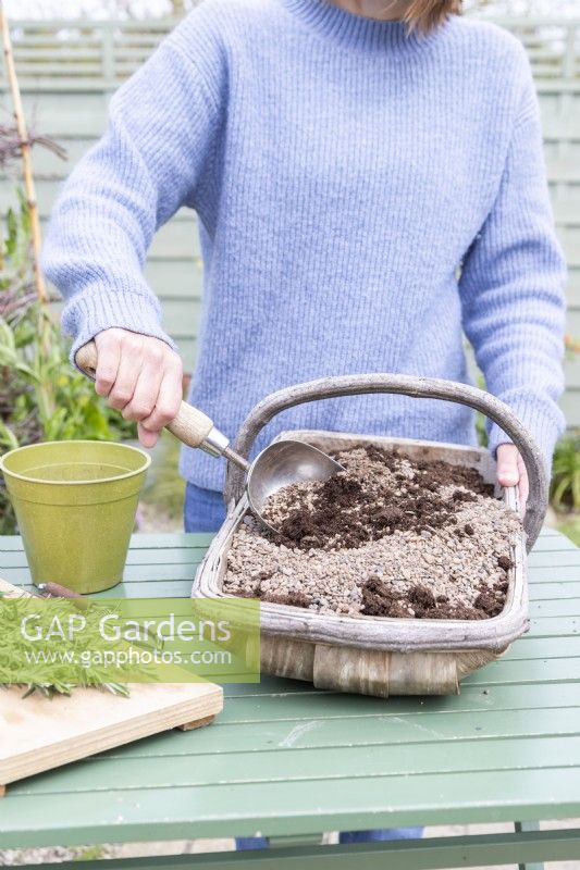 Woman mixing grit and compost