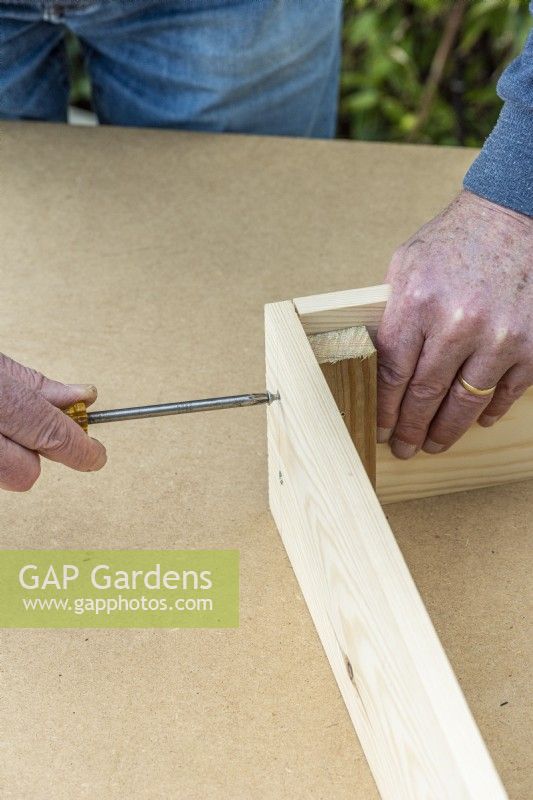 Step-by-Step Making a Plant Theatre. Step 13: assemble the pitched roof by screwing the two lengths together, having glued a timber offcut inside to help support the 90 degree angle