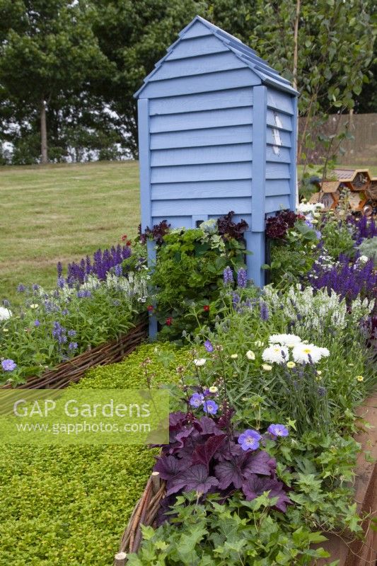 Blue beehive in the 'Bee Inspired' - Beautiful Borders at BBC Gardener's World Live 2018, June