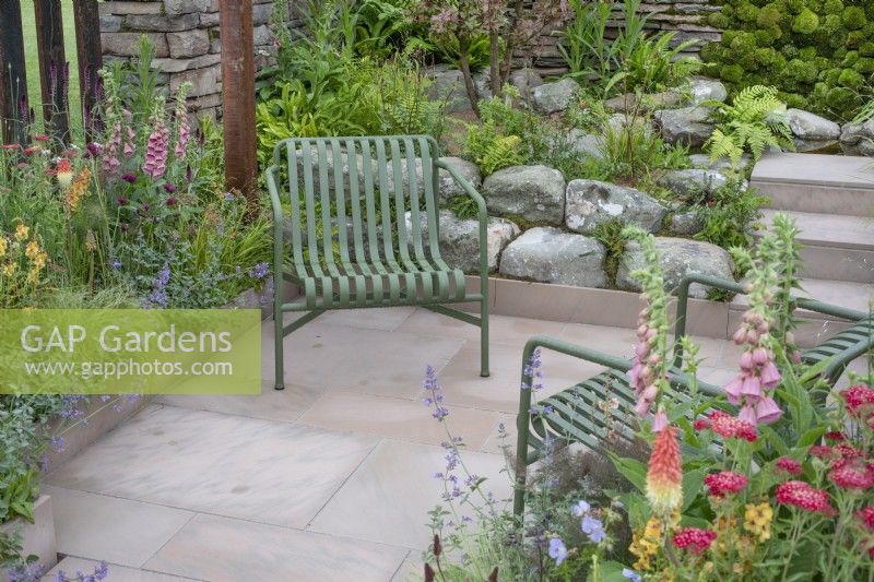 Seating area in 'Elements of Sheffield' garden at the RHS Chatsworth Flower Show 2019, June